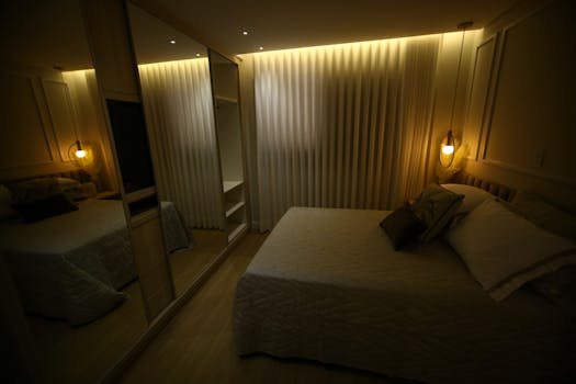 A warm and elegant bedroom with cozy lighting and modern furnishings.