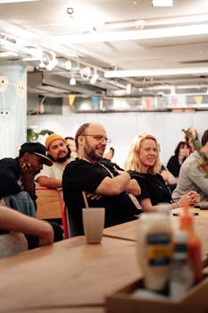 Group of people in a relaxed team meeting in a modern office in London.